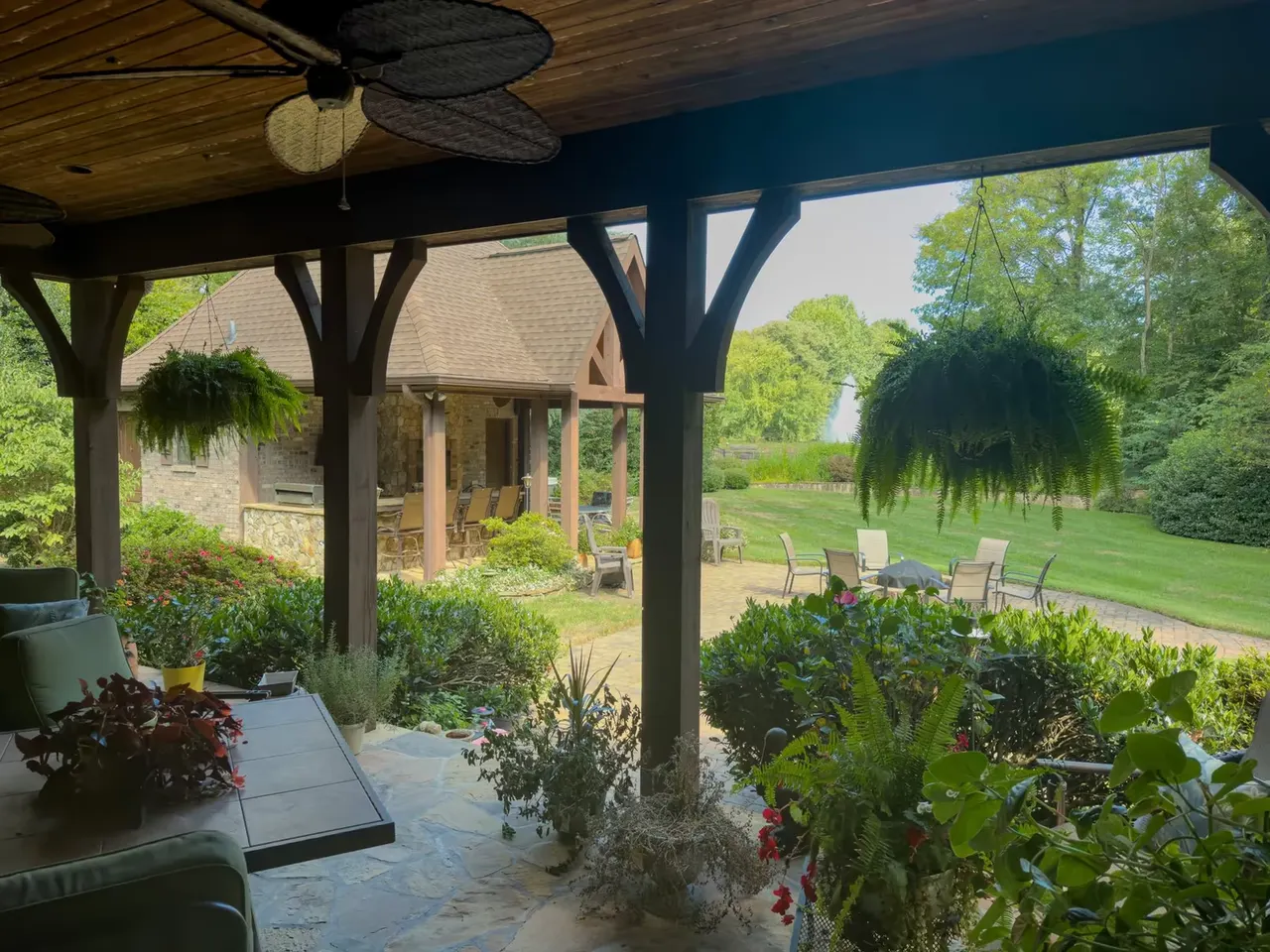 Lanai under timber trusses looking toward the cabana